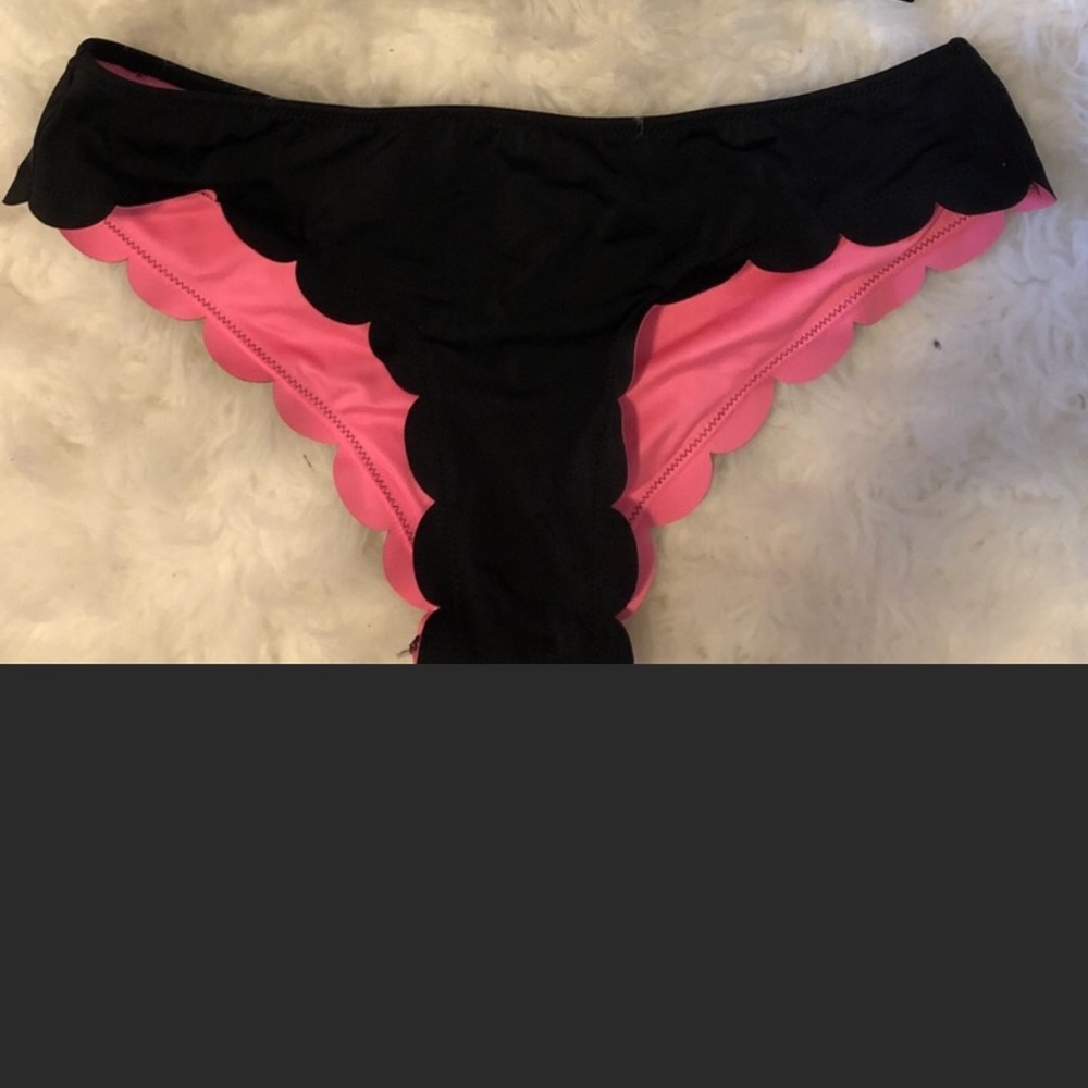 Victoria’s Secret black scalloped bikini bottoms.